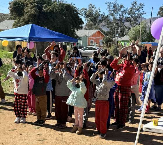 Children celebrating at a home dedication