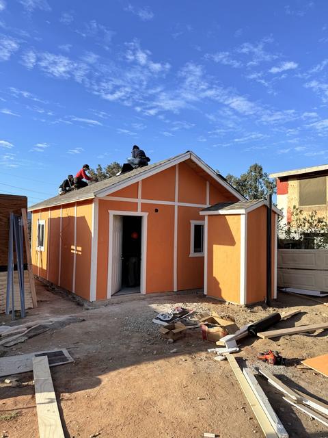 An orange home nearly finished
