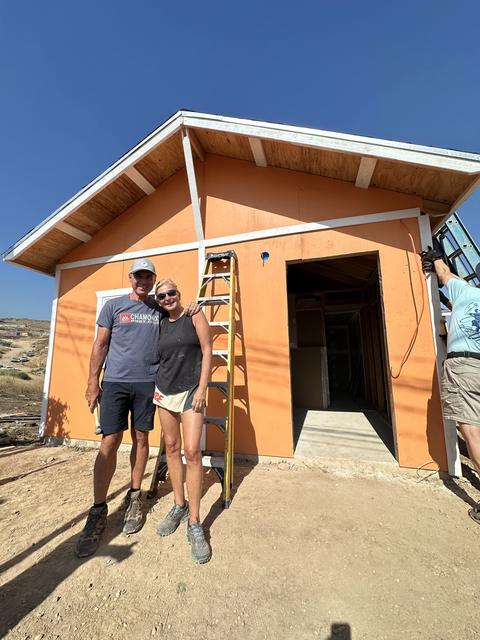 Volunteers at work on an orange home