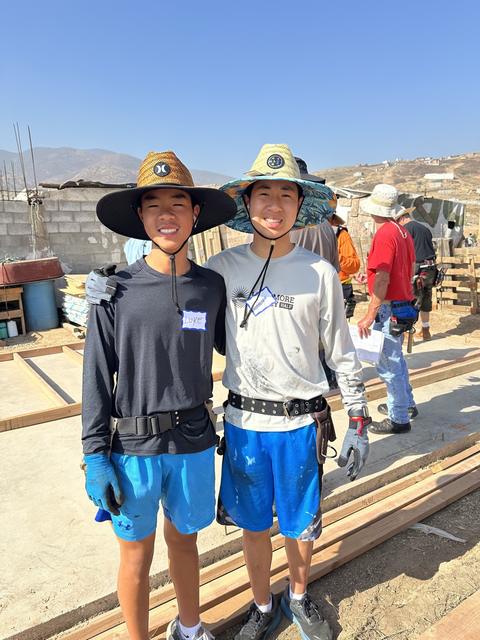 Two young volunteers on the build site