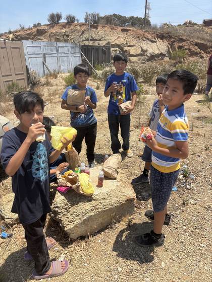 Local kids sharing snacks